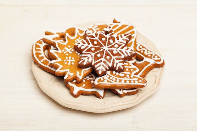 Christmas Cookie on White Wooden Background. Gingerbread, a traditional Scandinavian Christmas Food