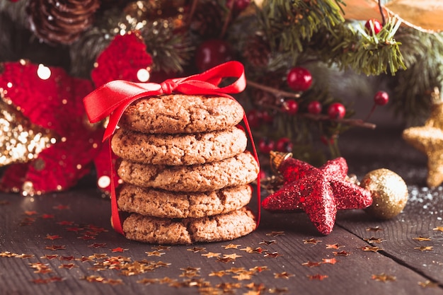 Christmas cookies on the table with red ribbon