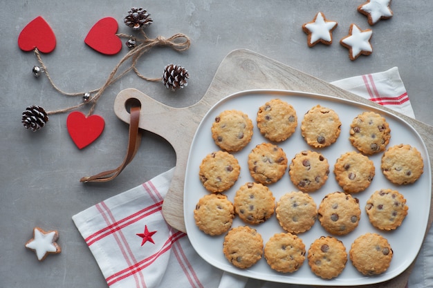 Christmas cookies with anise and cinnamon spices and winter decorations, top view