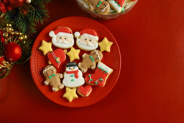 Christmas cookies with royal icing decoration with Red background