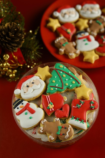 Christmas cookies with royal icing decoration with Red background