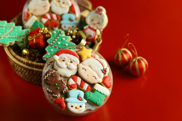 Christmas cookies with royal icing decorations with Red background