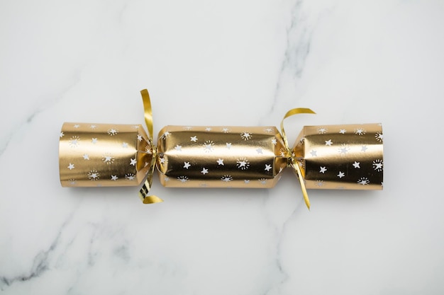 Christmas crackers luxury gold and black festive crackers on a marble background