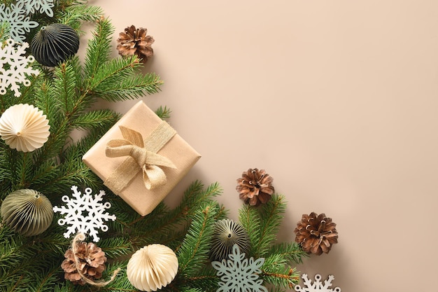 Christmas craft eco gift and festive composition with pine cones on beige background