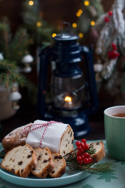 A Christmas cupcake on the background of a Christmas tree with lights Serving flour products