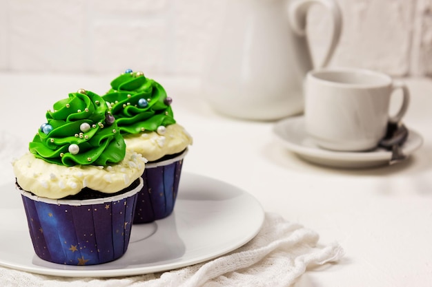 Christmas cupcakes milkman and a mug in the background Selective focus place for text