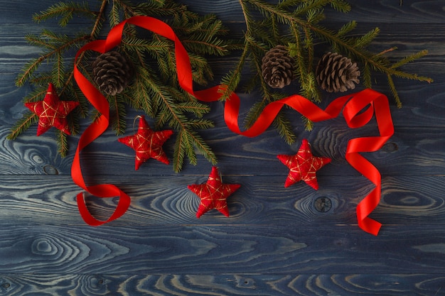 Christmas  decor and fir tree branch on wooden table. Top view with copy space