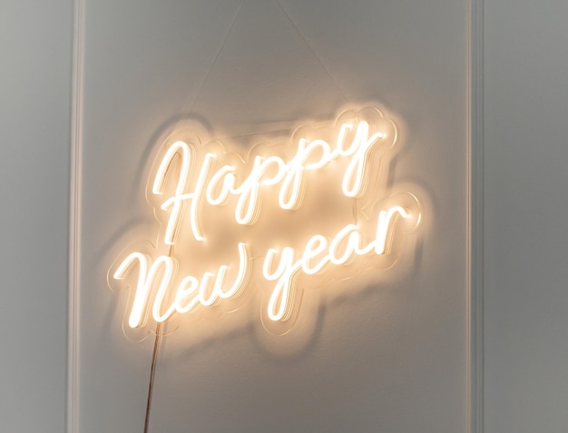 Christmas decor A flexible neon sign with the words Happy New Year hanging on the wall