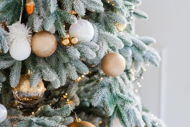 Christmas decoration on an abstract background Festively decorated Christmas tree Happy New Year Soft selective focus copy space