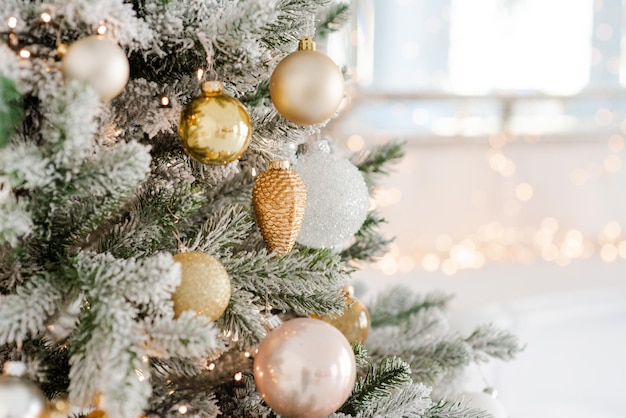 Christmas decoration on an abstract background Festively decorated Christmas tree Happy New Year Soft selective focus copy space