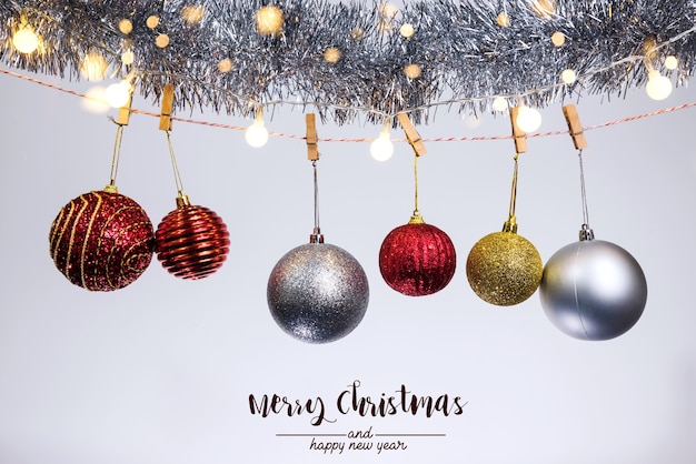 Christmas decoration balls and ornaments over abstract bokeh background on white background. Holiday background greeting card for Christmas and New Year. Merry Christmas