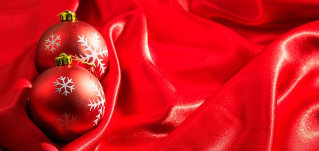 Christmas decoration Christmas balls on red satin background banner