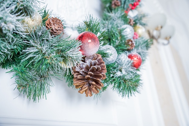 Christmas decoration, fir branches, garland and pinecone, christmas card