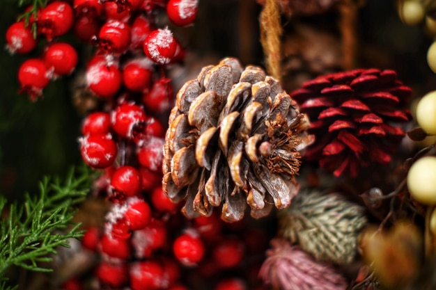 Christmas decoration made of pine cones and red berries