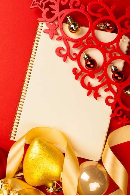 Christmas decoration on notebook, top view