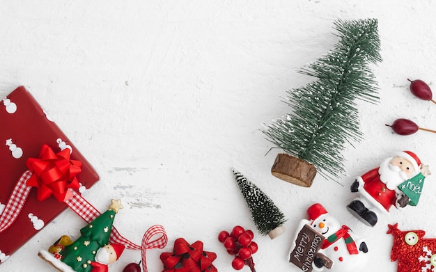 Christmas decoration toys and ornaments on rustic white wooden background. 