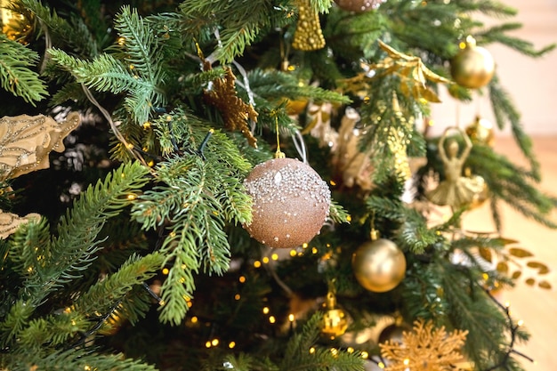 Christmas decoration white and golden balls hanging on pine branches christmas tree garland and orna