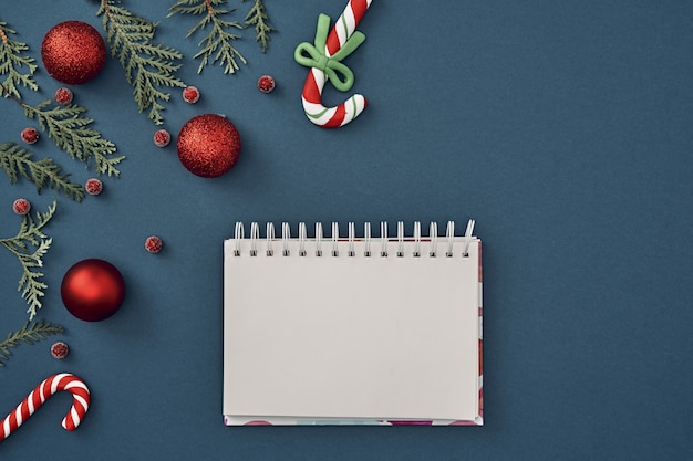 The Christmas decorations on blue background with various objects for writing