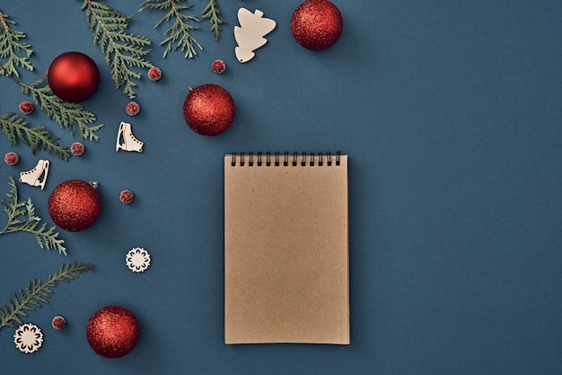 The Christmas decorations on blue background with various objects for writing