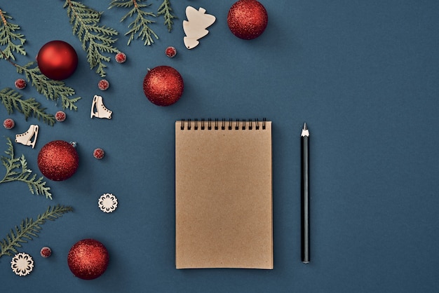 The Christmas decorations on blue background with various objects for writing