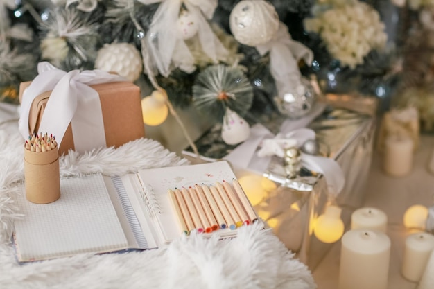 Christmas decorations boxes wrapped in wood colored paper and pencils made of wood