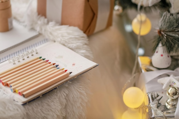 Christmas decorations boxes wrapped in wood colored paper and pencils made of wood