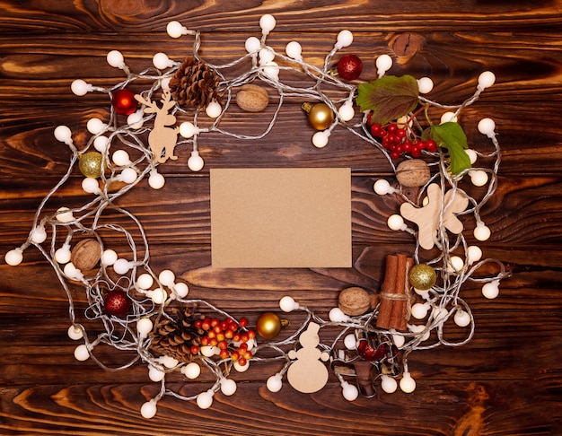 Christmas decorations and christmas lights on a wooden background. Composition of festive elements.