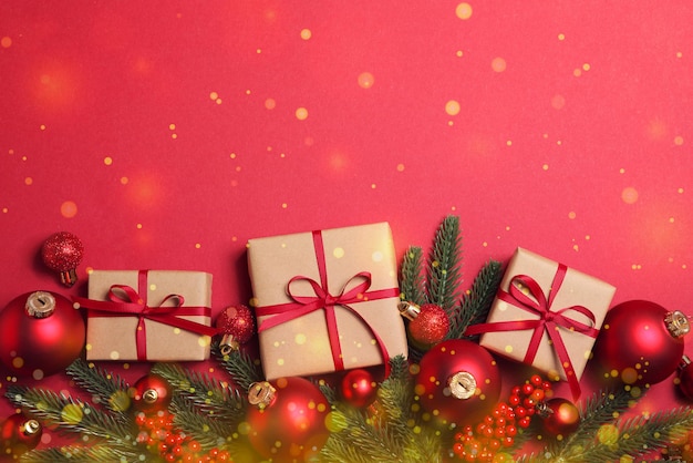 Christmas decorations and gifts on a colored background top view