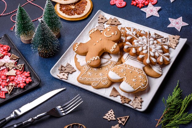 Christmas decorations and gingerbreads on a dark concrete table Getting ready to celebration