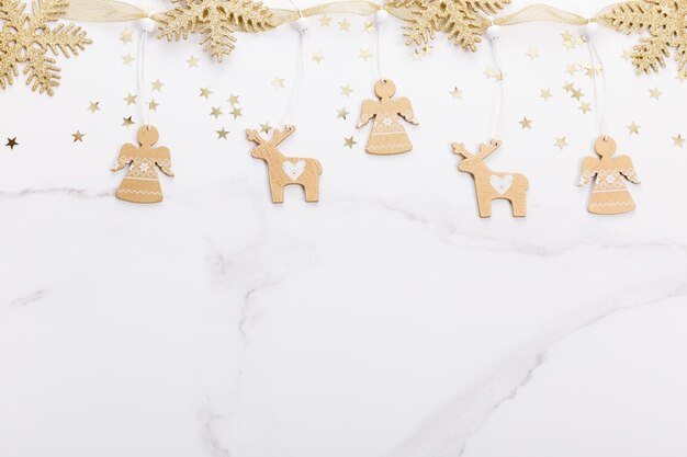 Christmas decorations in gold colors on white background gift holiday and celebration concept top vi