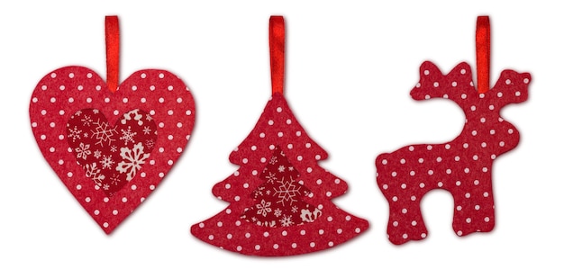 Christmas decorations handmade from red felt on a white background with clipping path