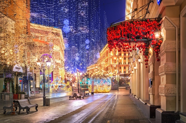 Christmas decorations on Nikolskaya street in Moscow in the light of night lights