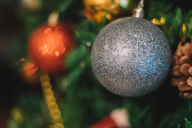 Christmas decorations, silver and red sparkle balls with glittering bokeh