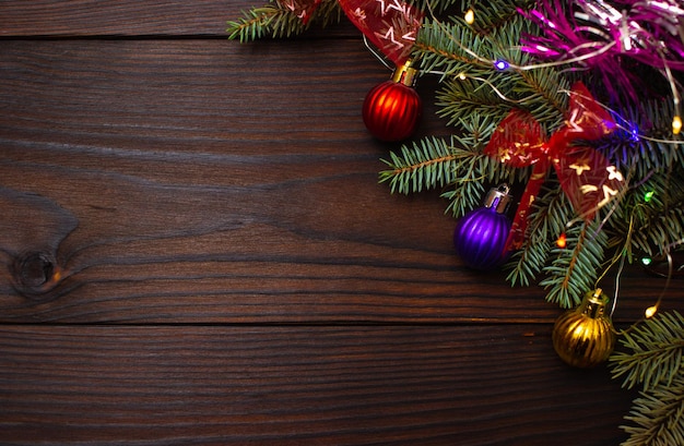 christmas decorations on the tree with a garland