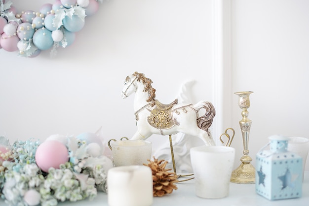 Christmas decorations on white fireplace