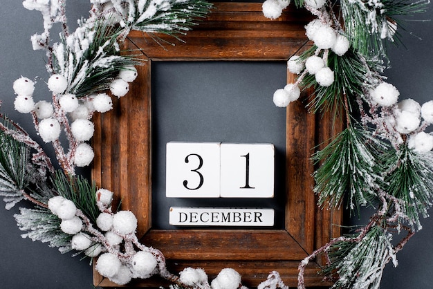 Christmas decorations and wooden frame Fir branch on a gray background copy space