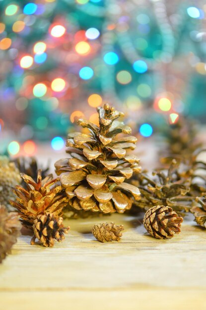 Christmas decorative with cone pine on glitter bokeh background Decorative arrangement of pine cones