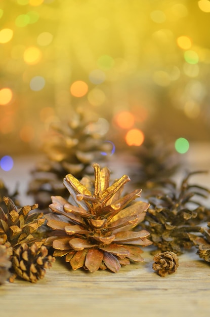 Christmas decorative with cone pine on glitter bokeh background Pine cones with Christmas lights