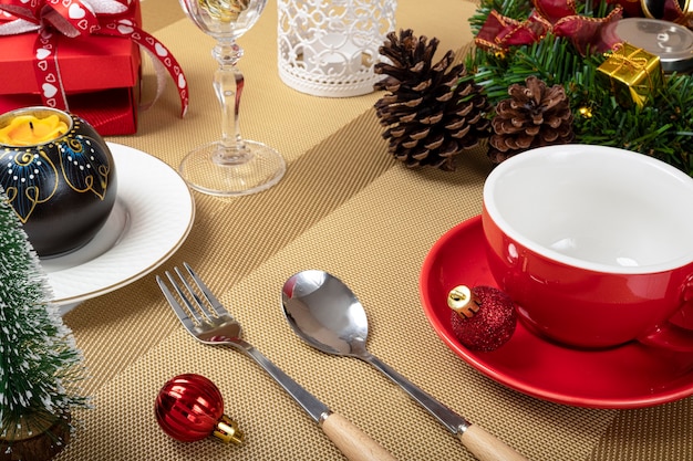 Christmas dinner table decorations with a plate of blueberry cheesecake