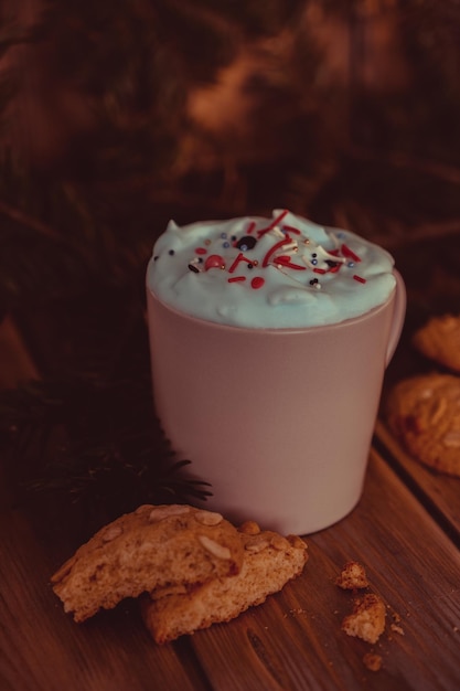 Christmas drink with homemade cookies on a wooden table