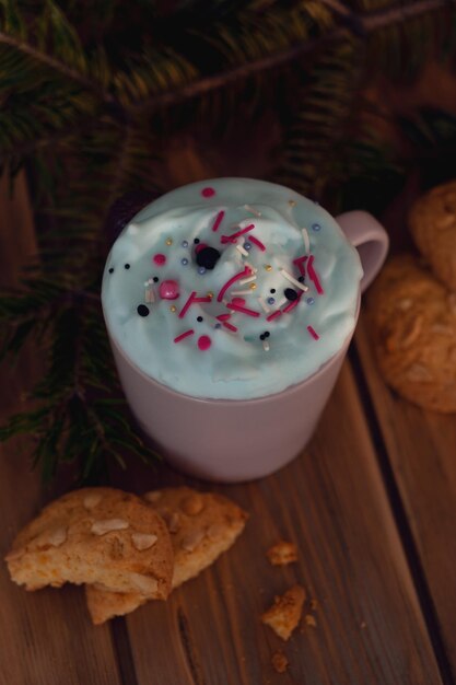 Christmas drink with homemade cookies on a wooden table