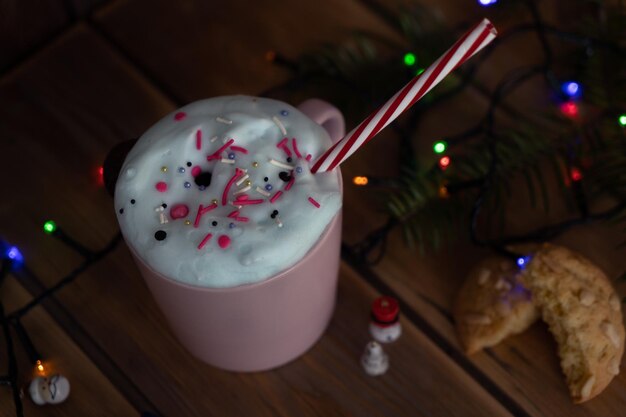 Christmas drink with homemade cookies on a wooden table