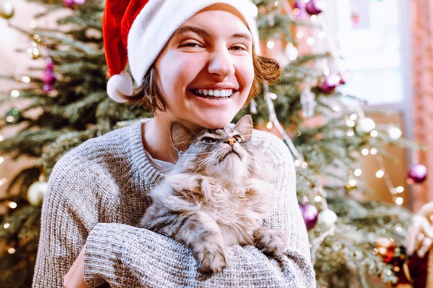 Christmas eve, pre-holiday card of teenager with pet