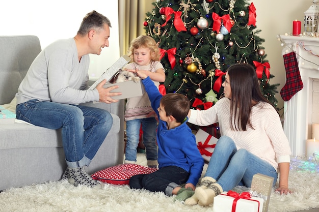 Christmas family portrait in home holiday living room, at morning