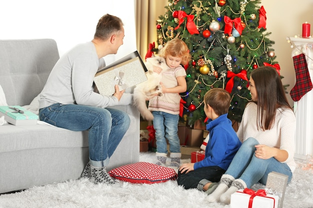 Christmas family portrait in home holiday living room, at morning