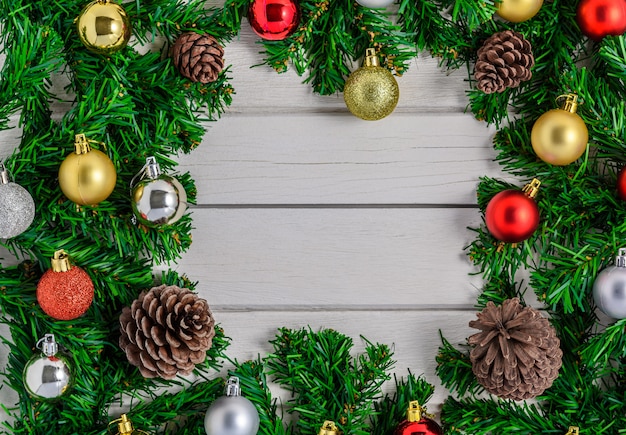 Christmas fir tree with decoration on white wooden board