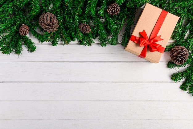 Christmas fir tree with decoration on white wooden board