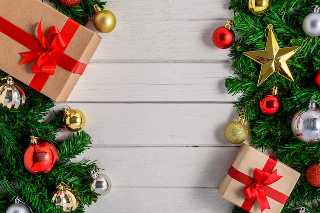 Christmas fir tree with decoration on white wooden board