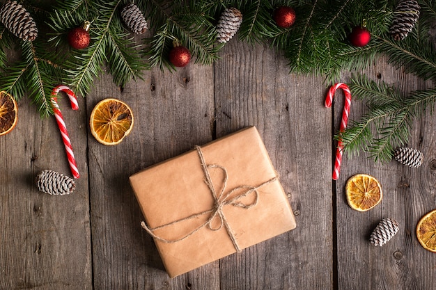 Christmas fir tree with decoration on a wooden board