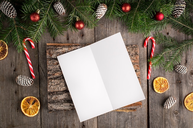 Christmas fir tree with decoration on a wooden board